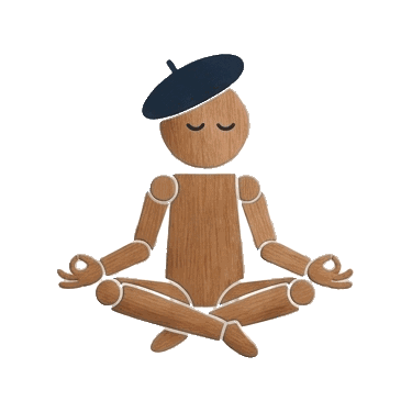 Rtistico wooden character seated in meditation